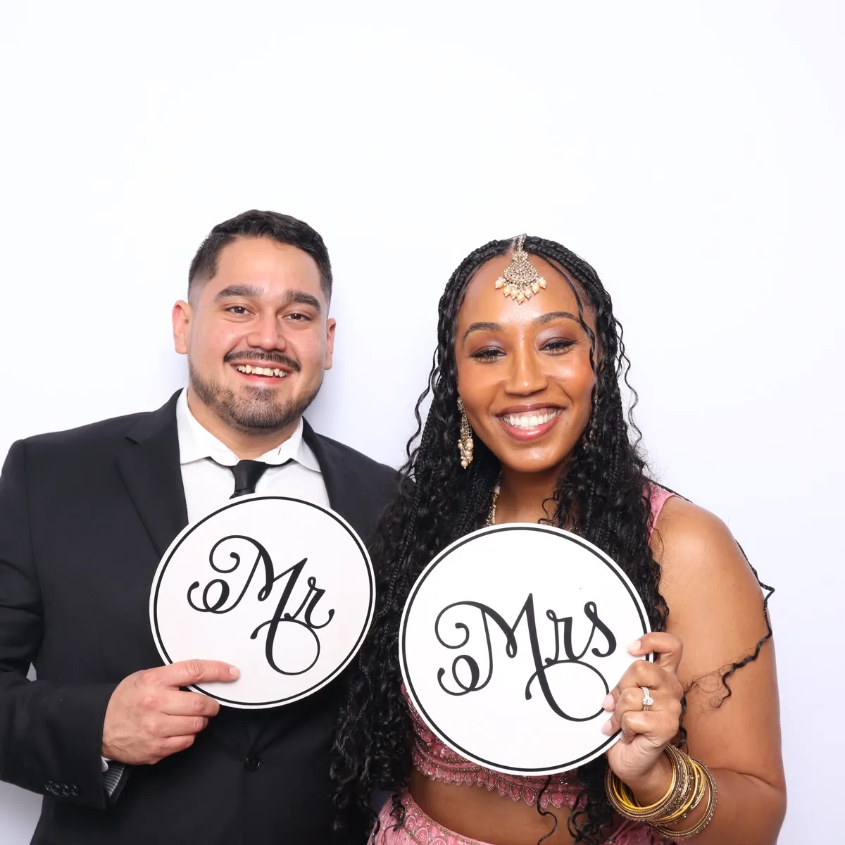 Clutch City luxury booth at Houston wedding with floral decor
